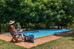 Nivaant Farms by StayVista - Green Retreat with Pool, Orchard, Jacuzzi & Gazebo